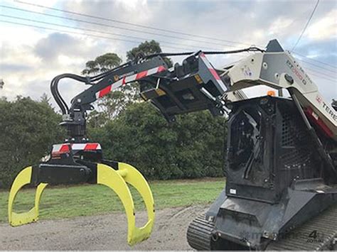 Skid Steer Skidding Logs 